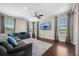 Comfortable living area featuring a large sofa, a flat-screen TV, and ample natural light at 398 Midden Pl, Castle Rock, CO 80104