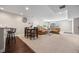 Comfortable living area with seating, a dining table, and a small bar, creating a welcoming atmosphere at 398 Midden Pl, Castle Rock, CO 80104