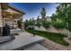 Spacious backyard with a covered patio, perfect for outdoor gatherings and barbecues at 4965 Malaya St, Denver, CO 80249