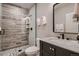 Bathroom features a tile shower, updated vanity, and neutral color palette at 4965 Malaya St, Denver, CO 80249
