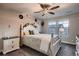 Inviting bedroom with stylish decor, ceiling fan and a view of the neighborhood at 4965 Malaya St, Denver, CO 80249