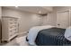 Bedroom with dresser, and a black and white comforter set at 4965 Malaya St, Denver, CO 80249