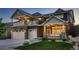 Beautiful two-story home with a well-manicured lawn and a welcoming covered front porch at 4965 Malaya St, Denver, CO 80249