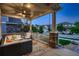 Relaxing covered porch with comfortable seating and a view of the neighborhood at 4965 Malaya St, Denver, CO 80249