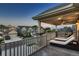 Upper-level balcony with comfortable seating and a scenic neighborhood view at 4965 Malaya St, Denver, CO 80249