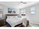 Bedroom boasts a large bed, and plenty of natural light from two windows at 23576 E 5Th Pl, Aurora, CO 80018