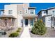 Inviting two-story home with stone accents, manicured landscaping, and a welcoming front porch at 23576 E 5Th Pl, Aurora, CO 80018