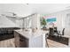 Bright living room featuring modern stainless steel appliances, with dining area and cozy seating at 23576 E 5Th Pl, Aurora, CO 80018