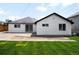 Backyard with freshly cut lawn and extended patio, perfect for outdoor entertaining at 461 S Lowell Blvd, Denver, CO 80219