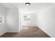 Bright bedroom with neutral carpet, white walls and trim, plus a window view to the outdoors at 461 S Lowell Blvd, Denver, CO 80219