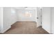 Bright bedroom featuring neutral carpet, white walls, and a single window at 461 S Lowell Blvd, Denver, CO 80219