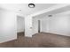 Bright bedroom featuring neutral carpet, white walls, and views of other rooms at 461 S Lowell Blvd, Denver, CO 80219