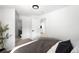Inviting bedroom offering plush bedding, neutral decor, and an ensuite bathroom at 461 S Lowell Blvd, Denver, CO 80219