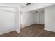Bright bedroom featuring neutral carpet, white walls, closet, and adjacent bedroom views at 461 S Lowell Blvd, Denver, CO 80219