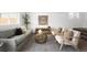 A cozy living room featuring neutral walls, modern furniture, and an attractive area rug, creating a warm, inviting space at 461 S Lowell Blvd, Denver, CO 80219