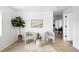 Bright and inviting living room with hardwood floors, neutral decor and ample natural light at 461 S Lowell Blvd, Denver, CO 80219