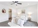 This bedroom boasts neutral décor, a comfortable bed with side tables, and a walk-in closet at 8057 Monte Vista Cir, Littleton, CO 80125