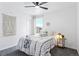 Comfortable bedroom featuring stylish bedding, a side table, and plenty of natural light at 8057 Monte Vista Cir, Littleton, CO 80125