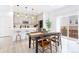 Dining area with view to the kitchen and a sliding glass door to the outside at 8057 Monte Vista Cir, Littleton, CO 80125