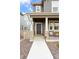 Inviting front entrance with stone accents and a charming front porch at 8057 Monte Vista Cir, Littleton, CO 80125