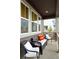 Cozy front porch with comfortable seating, perfect for relaxing outdoors at 8057 Monte Vista Cir, Littleton, CO 80125