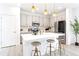 Updated kitchen with stainless steel appliances, island seating, and ample cabinet space at 8057 Monte Vista Cir, Littleton, CO 80125