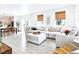 Bright living room featuring a spacious sectional sofa and stylish decor at 8057 Monte Vista Cir, Littleton, CO 80125