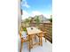 Outdoor patio features wooden table and chairs, offering a great space for relaxing at 8057 Monte Vista Cir, Littleton, CO 80125