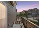 Cozy outdoor patio with seating, wooden fence, and lovely neighborhood view at 8057 Monte Vista Cir, Littleton, CO 80125