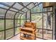 Enclosed green house for growing herbs and plants with natural light and potting station at 20496 Stonewood Trl, Morrison, CO 80465