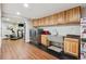 Utility space boasts a laundry area, sink, and ample cabinets for storage and appliances at 20496 Stonewood Trl, Morrison, CO 80465