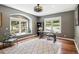 Office area with hardwood floors, windows, and gray walls at 20496 Stonewood Trl, Morrison, CO 80465