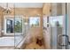 Elegant shower with glass enclosure featuring mountain views and tiled surround at 20496 Stonewood Trl, Morrison, CO 80465