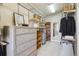 Spacious walk-in closet with ample shelving, drawers, and organized storage solutions at 20496 Stonewood Trl, Morrison, CO 80465