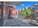 View of balcony with iron railing overlooking street and brick buildings at 1438 Little Raven St # 201, Denver, CO 80202