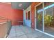 View of private balcony with table, tile floors, and brick surround at 1438 Little Raven St # 201, Denver, CO 80202