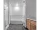 Sleek bathroom featuring a tub, shower, and wood vanity at 1438 Little Raven St # 201, Denver, CO 80202