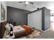 Bedroom featuring modern gray walls, a decorative rug, and a large closet at 1438 Little Raven St # 201, Denver, CO 80202