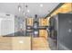 A stylish kitchen with stainless steel appliances and wood cabinets at 1438 Little Raven St # 201, Denver, CO 80202
