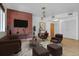 Cozy living room with a brick accent wall, modern furniture, and hardwood floors at 1438 Little Raven St # 201, Denver, CO 80202
