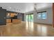 Open living room and kitchen area with hardwood floors and modern lighting at 1438 Little Raven St # 201, Denver, CO 80202