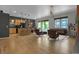 Open concept living room with kitchen, dining area, and modern furniture at 1438 Little Raven St # 201, Denver, CO 80202