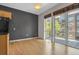 Bright, open living room with hardwood floors, neutral walls, and a balcony view at 1438 Little Raven St # 201, Denver, CO 80202