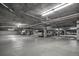 View of well-lit parking garage with visible parking spaces and parked vehicles at 1438 Little Raven St # 201, Denver, CO 80202