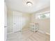 A cozy bedroom featuring neutral walls, carpet, a window, and a shelf on wheels at 6953 Elati Way, Denver, CO 80221