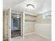 Cozy bedroom with plush carpeting, soft lighting, wainscoting and a built-in closet for storage at 6953 Elati Way, Denver, CO 80221