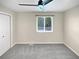 Neutral bedroom with carpet floor, ceiling fan and a window for plenty of natural light at 5480 W 74Th Ave, Arvada, CO 80003