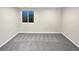 Simple bedroom offers a large window and neutral carpet at 5480 W 74Th Ave, Arvada, CO 80003