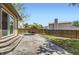 Backyard patio with outdoor dining set and view of the fenced yard at 904 Fieldstone Pl, Highlands Ranch, CO 80126