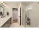 Contemporary bathroom with a glass-enclosed shower, modern vanity, and clean white tiles at 904 Fieldstone Pl, Highlands Ranch, CO 80126
